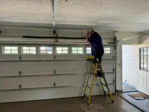 James installing a new garage door