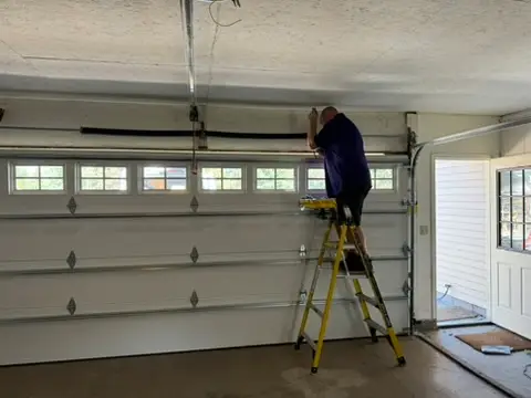 James installing a new garage door