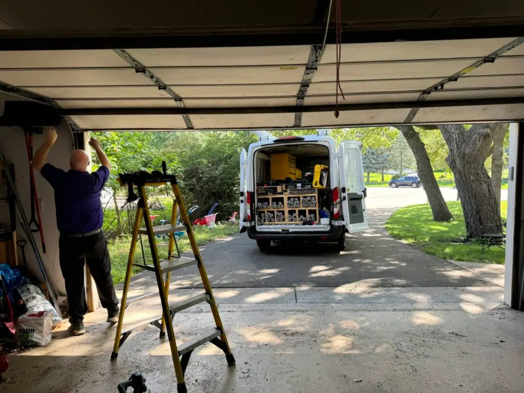 James repairing a garage door