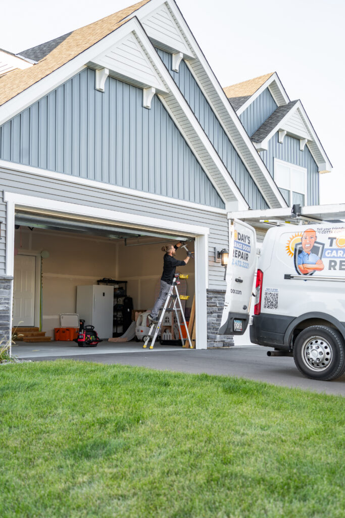 Technician servicing a garage door
